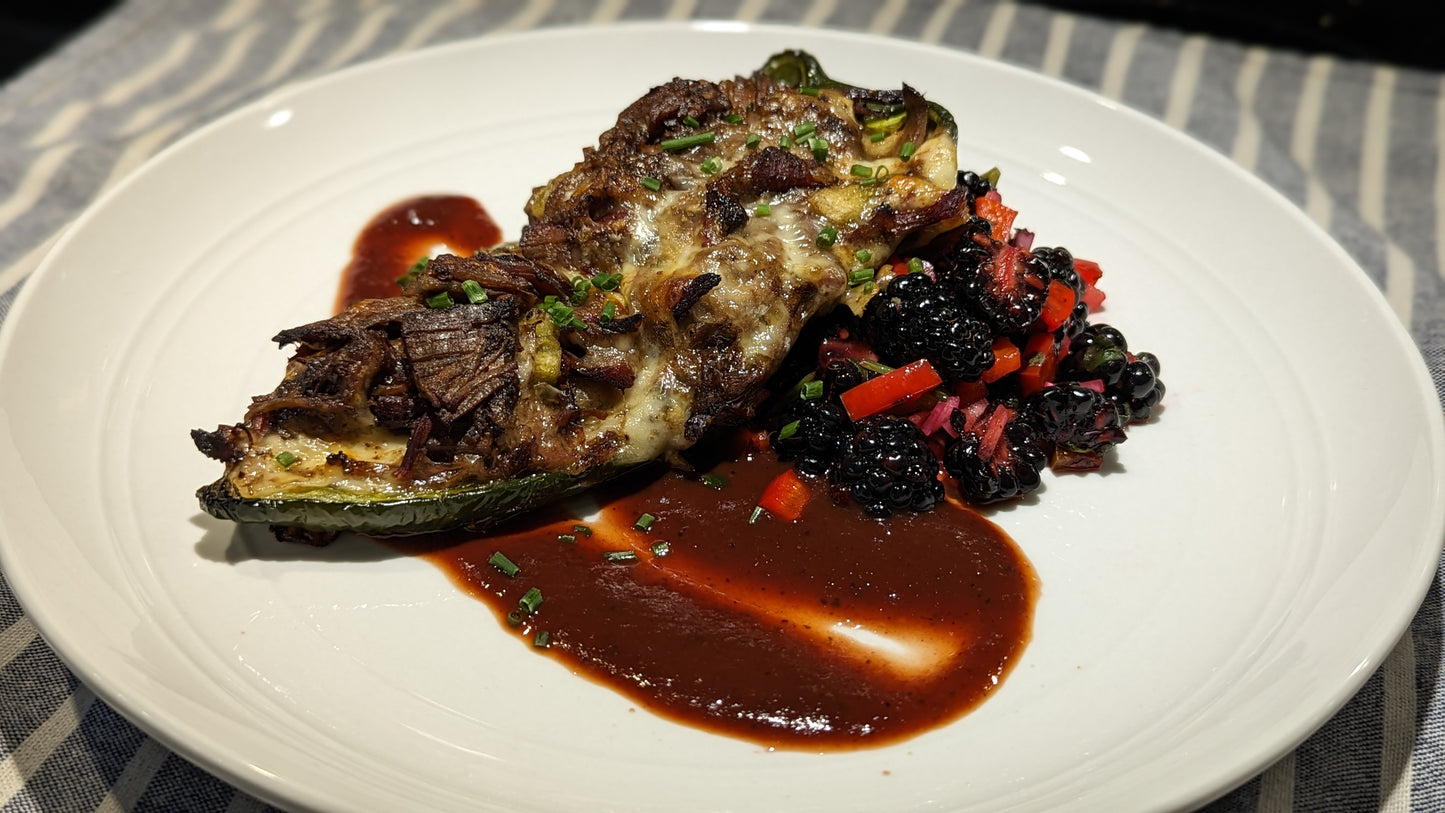 brisket stuffed poblano pepper with blackberry sauce